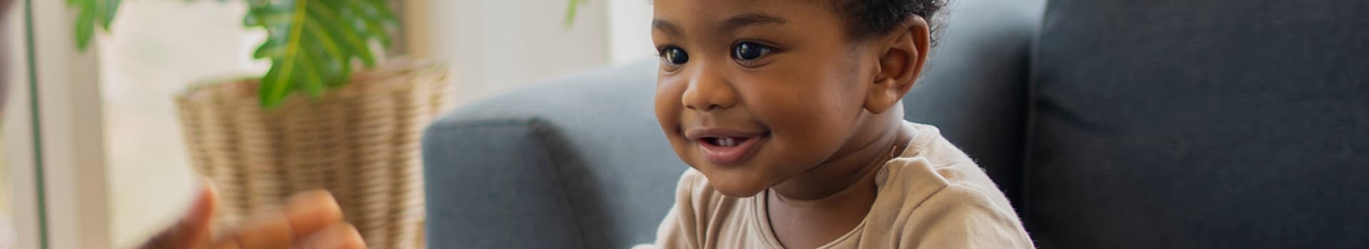 Small child smiling.