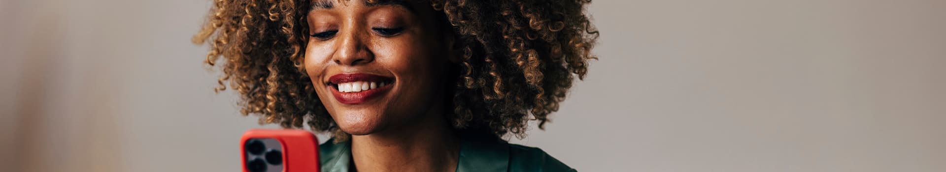 Woman using Primary Care On Demand app on phone