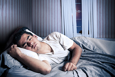 Man sleeping in bed