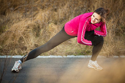 young-woman-stretching-before-run