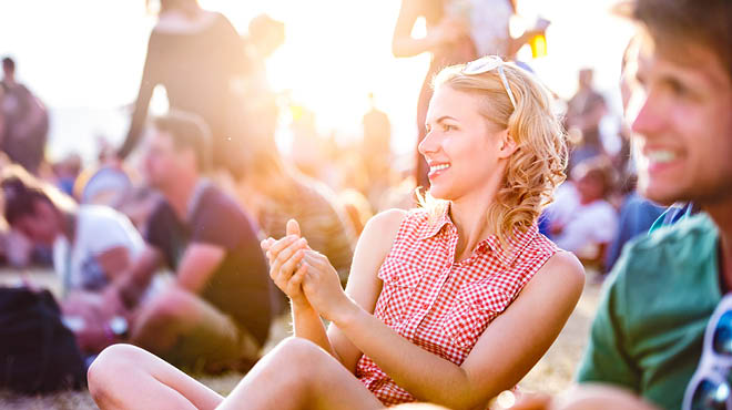 Sitting people enjoying a festival