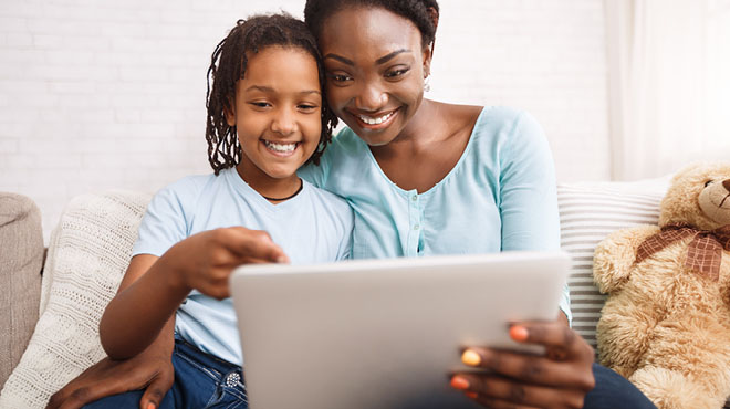 Daughter and mom virtual visit on laptop