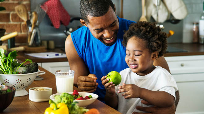 Dad and child sharing nutritious food