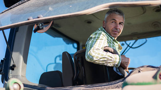 Farmer in tractor cab