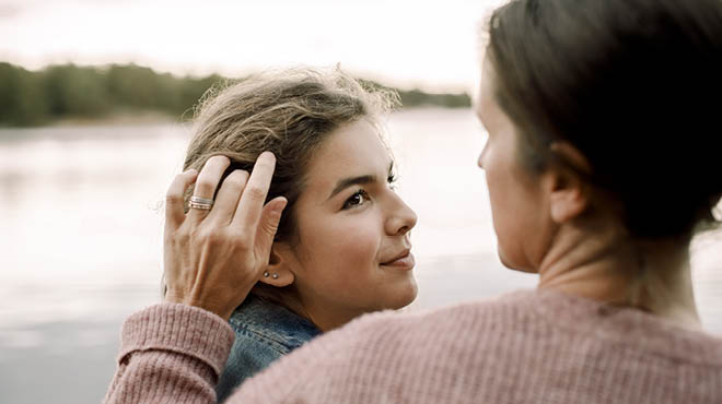 Mom smoothing child's hair