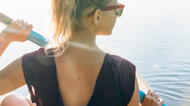 Back view of paddleboarder