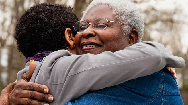 Child hugging grandparent