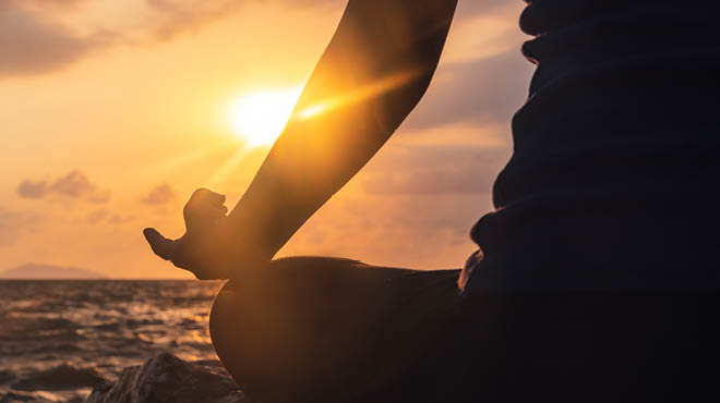 Meditating by the ocean