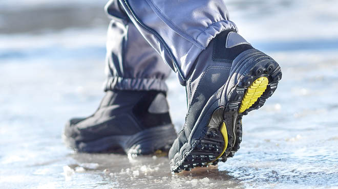 Walking on ice wearing boots