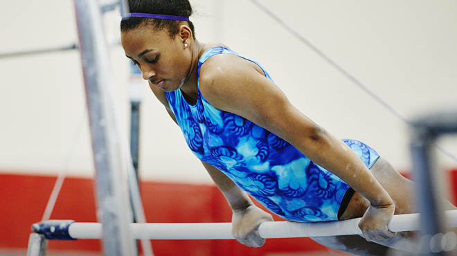 Gymnast on uneven bars