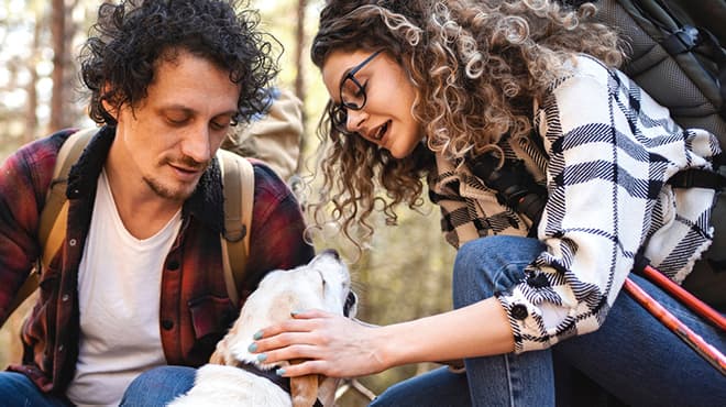 Hiking couple with dog