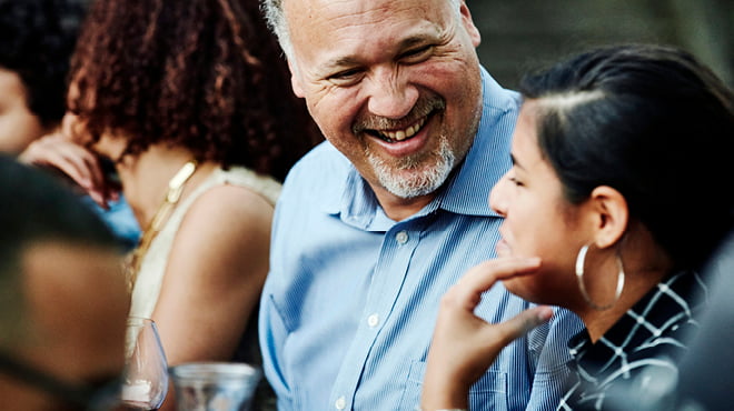 Person laughing with friends