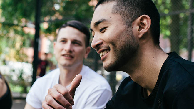 Two people sitting outdoors