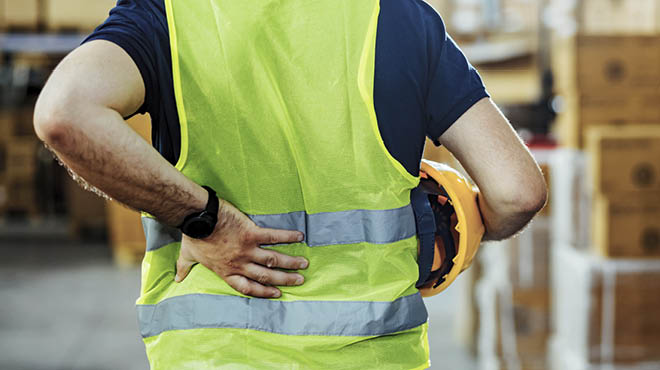 Wearing safety vest holding back