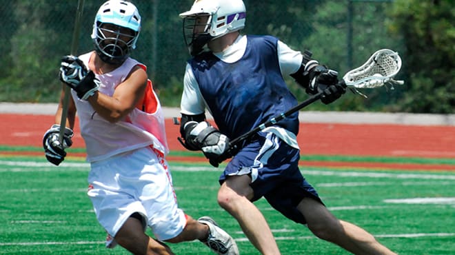 Young athletes playing lacrosse