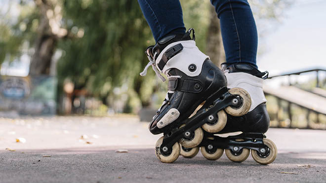 Closeup of rollerblades on a person's feet