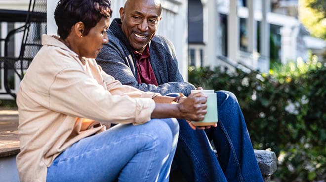 Couple sitting on steps outside