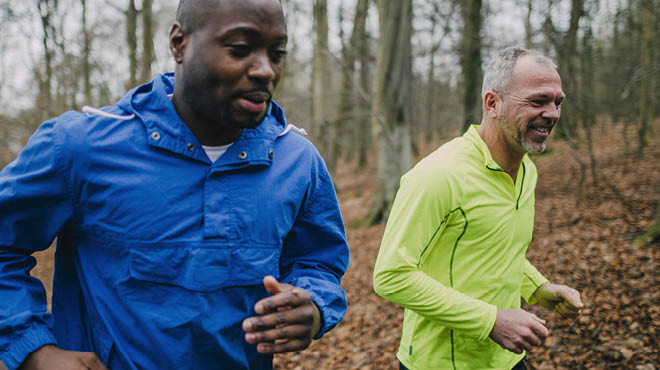 Two runners in woods