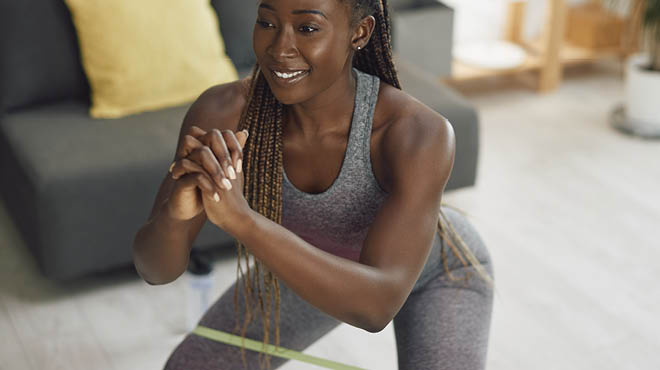 Woman squat exercising