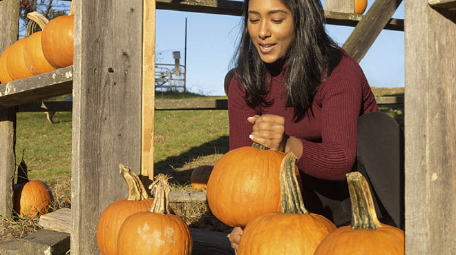 Woman with pumpkins